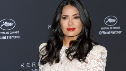 Salma Hayek sizzles in a bright blue swimsuit on her 55th birthday