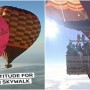 Man walking between hot air balloons suspended over 6,500 meters in the air