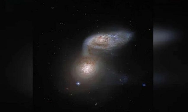 Netizens are astonished by NASA's image of two spiral galaxies dancing together