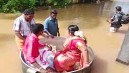 Watch: Severe flooding forces couple to float to their wedding in a cooking pot