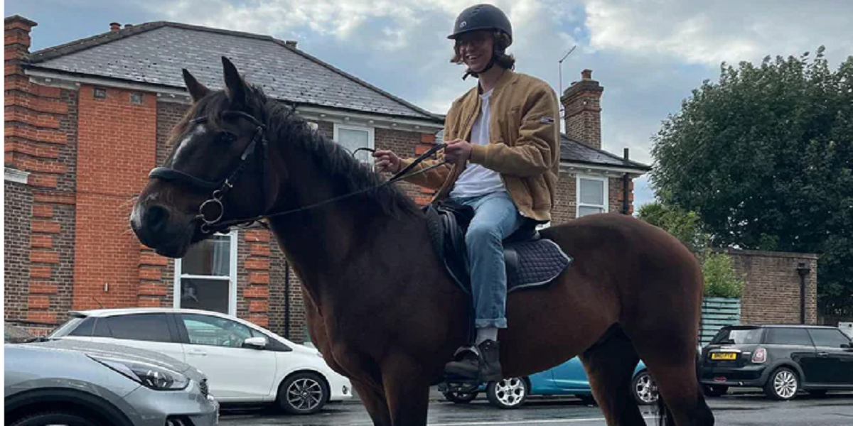 Midst of the UK's fuel crisis: A man rides his horse to a petrol station