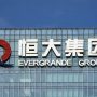 Evergrande to resume trading, warns of financial obligations