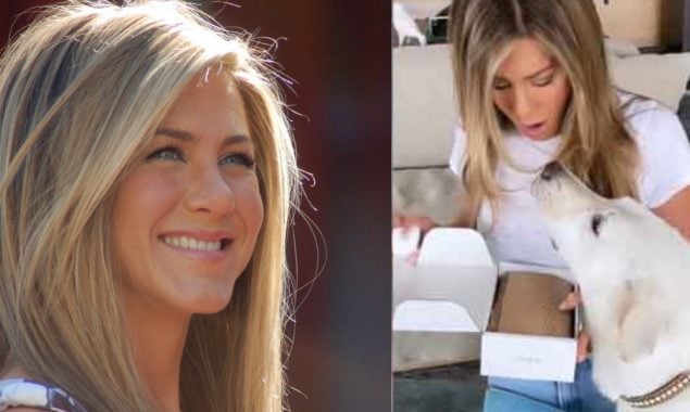 Jennifer Aniston promotes her brand while dressed in a white top and blue jeans.