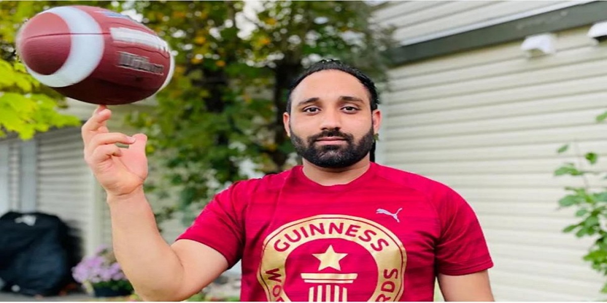 World record: A man spins a football for 21.66 seconds on his finger