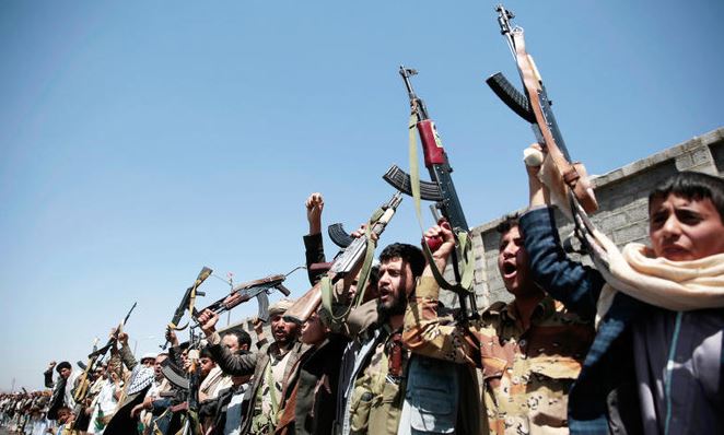 Tribesmen loyal to Houthi rebels, hold their weapons as they chant slogans during a gathering aimed in Sanaa, Yemen.