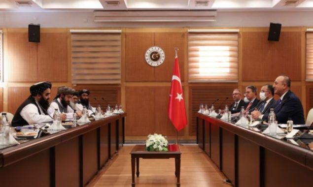 Turkish Foreign Minister Mevlut Cavusoglu (1st R) meets with Afghanistan's acting Foreign Minister Amir Khan Muttaqi