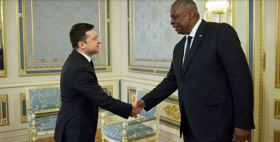 Ukrainian President Volodymyr Zelensky and US Defense Secretary Lloyd Austin shake hands during a meeting in Kiev on October 19, 2021.