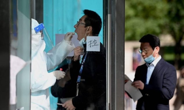 China locks down city of four million over Covid