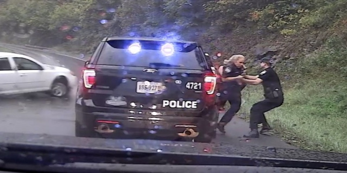 Watch: Police officer saves colleague from out-of-control car