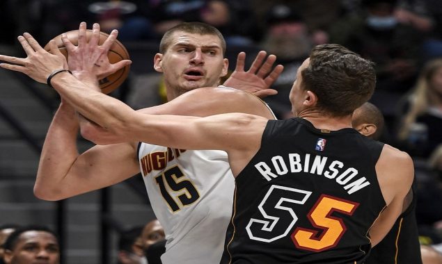 Booed Jokic leads Nuggets past short-handed Heat