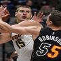 Booed Jokic leads Nuggets past short-handed Heat