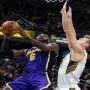 James shines late as Lakers down Pacers in overtime, Warriors beat Sixers
