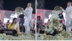Bucketful of cash poured on Gujarati folk singer during a performance
