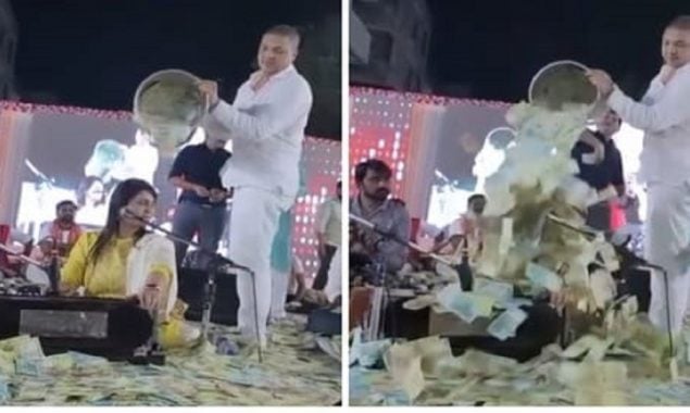 Bucketful of cash poured on Gujarati folk singer during a performance