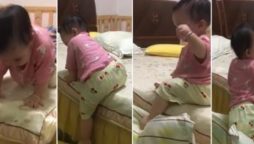 Baby girl gets out of bed using this brilliant technique