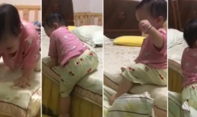 Watch: Baby girl gets out of bed using this brilliant technique