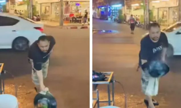 Street vendor tosses food from a wok to a man in viral video