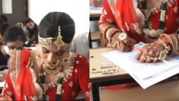 The Indian bride arrives at the exam hall  on her wedding day