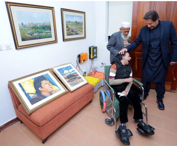 Artist suffering from cerebral palsy gifts PM Imran his self-painted portraits