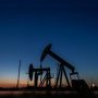 Stocks sink, oil tanks as new virus variant sparks panic