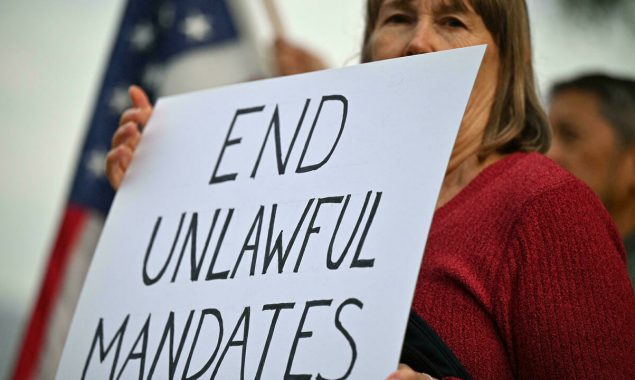 Vaccine mandates are working in US, but are still divisive