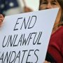 Vaccine mandates are working in US, but are still divisive