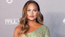 Chrissy Teigen flaunts her beautiful legs in lovely black gown as she joins husband John Legend for dinner in London