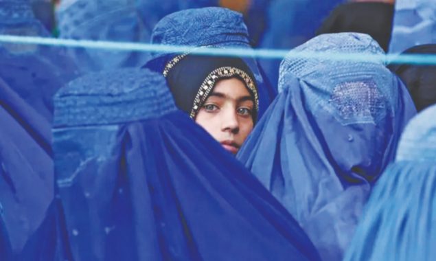 Taliban religious police issue posters ordering women to cover up