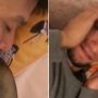Wife pranks her husband while he is sleeping. His reaction is hilarious