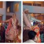 Watch: The bride and groom ride on horses at their wedding entry