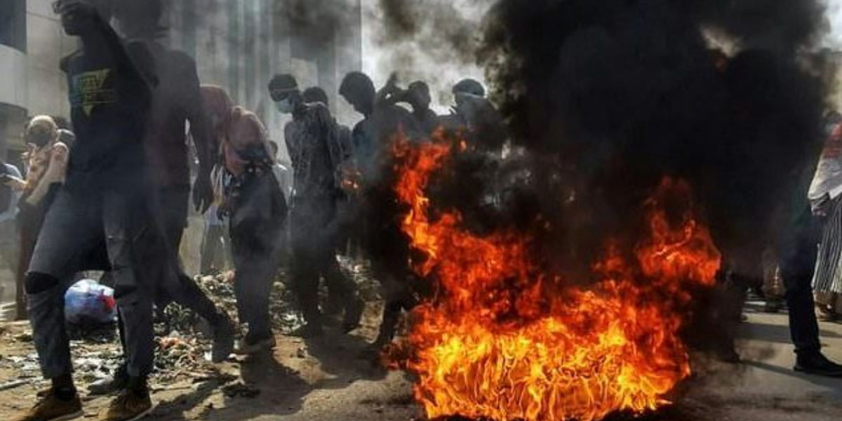 Tear gas and burning tyres as thousands rally in Sudan against the coup