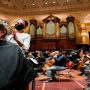 Customers get a haircut in a hall as museums and concert halls protest against the Dutch government