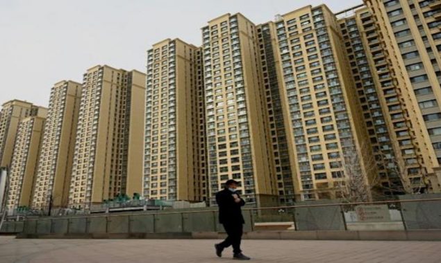 China cuts lending rates, boosting property firms