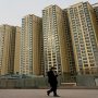 China cuts lending rates, boosting property firms
