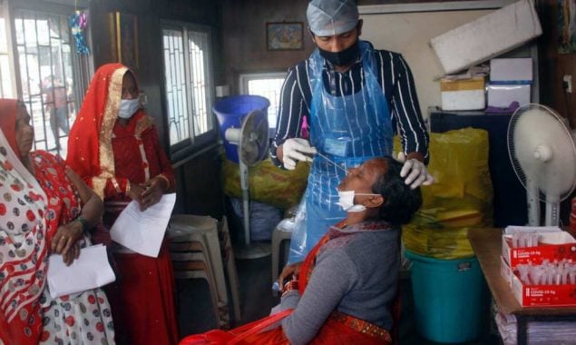 India reports 209,918 new COVID-19 cases