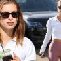 Hailey Bieber flaunts her toned body in a cropped top and leggings