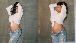 Kylie Jenner shows off her growing baby bump in style