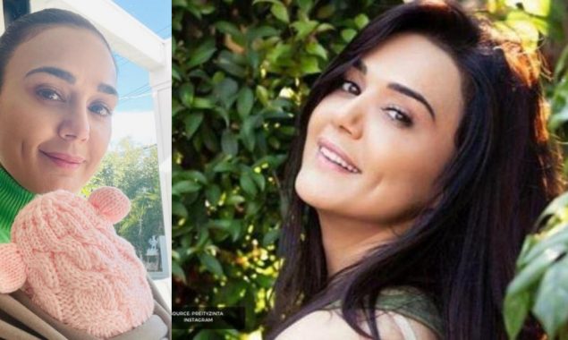 Preity Zinta flashes her dimpled smile with one of her twins; see picture