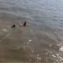 Woman falls in the sea while riding a boat
