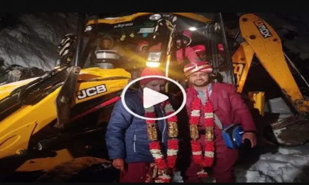 Dulha rides on JCB to arrive at his own wedding due to heavy snowstorm