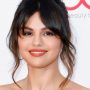 Selena Gomez shows off her elegance in a green robe-like coat