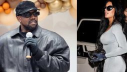 Kanye West enjoys the company of Kim Kardashian’s doppelganger. Chaney Jones at a Jeen-Yuhs screening