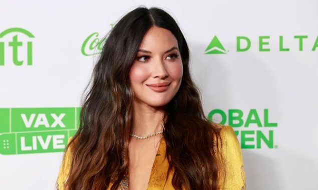 In an adorable new photo, Olivia Munn says she’s transforming her baby boy Malcolm into a ‘buttered biscuit.’