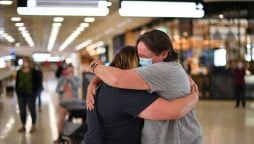 New Zealand opens borders with tears, hugs