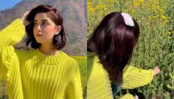 Alizeh Shah harvesting crops in this neon-coloured sweatshirt.