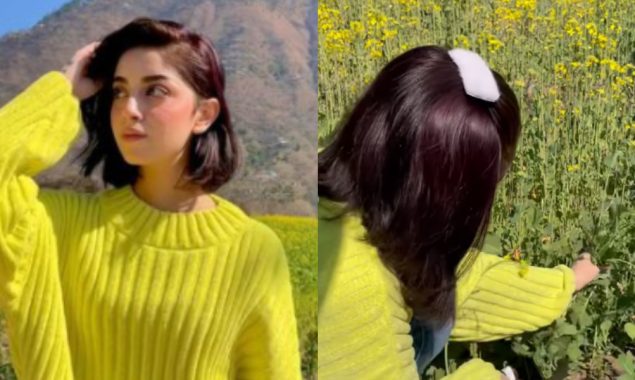 Alizeh Shah harvesting crops in this neon-coloured sweatshirt.
