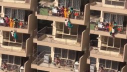 Watch Video: A mother hangs her child to pick up saree from the 10th floor