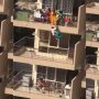 Watch Video: A mother hangs her child to pick up saree from the 10th floor