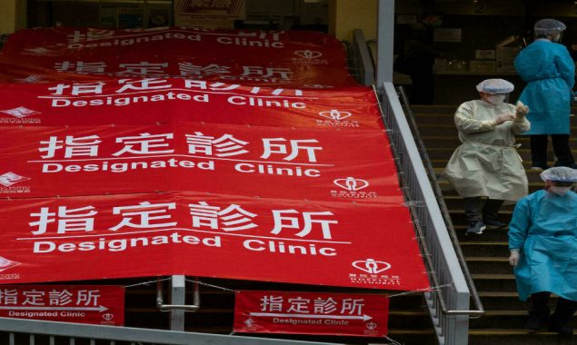 Virus-hit Hong Kong invokes emergency powers to allow in China medics