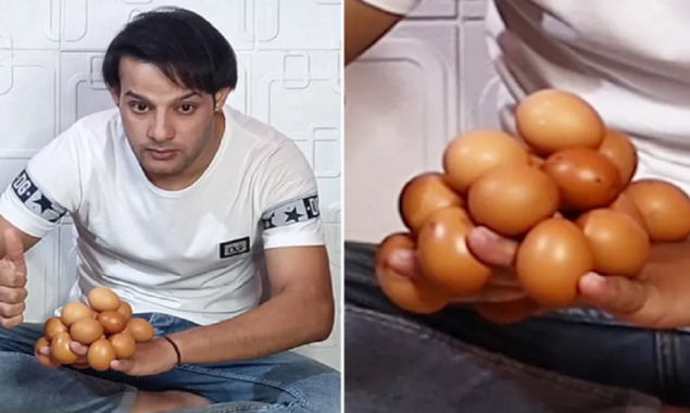 World Record: An Iraqi man balances 18 eggs on back of his hand